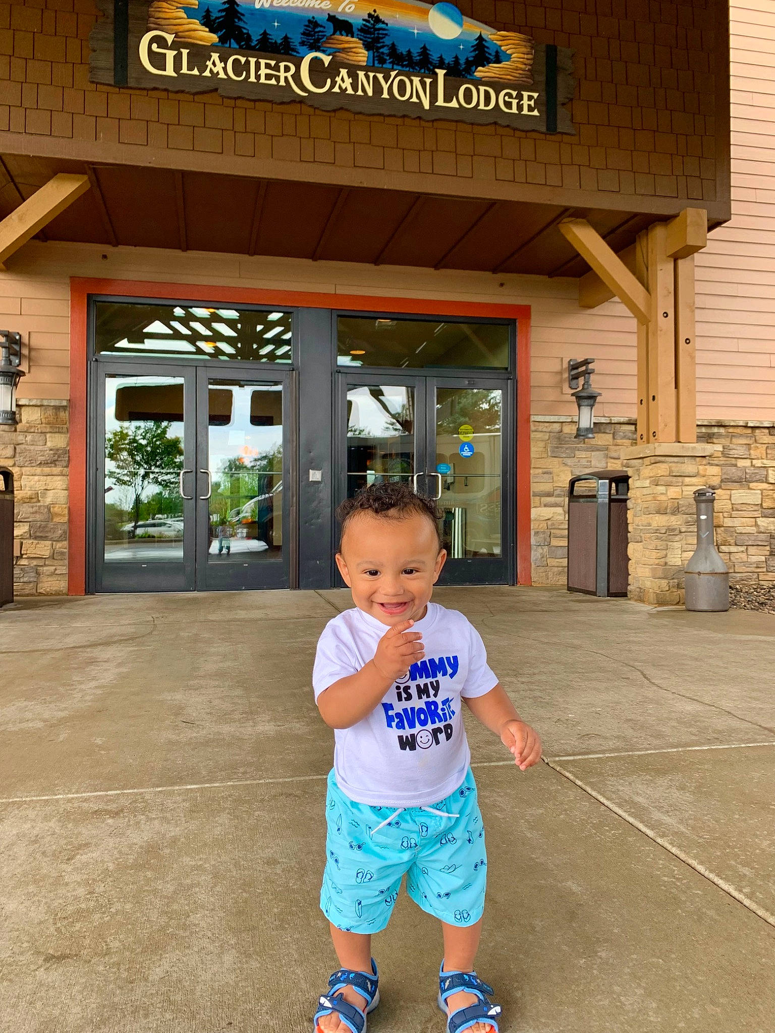 Jayceon is registered to the contest to win money with this photo: baby, baby_toddler_clothing, building, child, door, electric_blue, flooring, fun, happy, human_leg, joy, leisure, logo, person, recreation, shorts, t_shirt, thumb, toddler, tourism