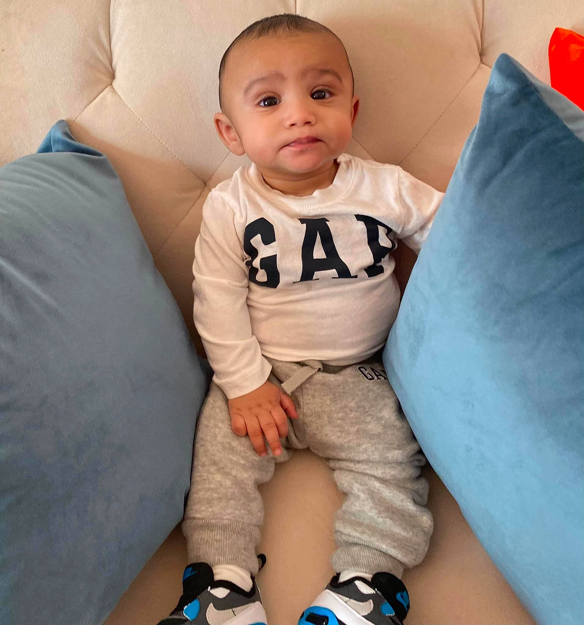 Jayceon joined the competition — help win amazing prizes! baby, baby_toddler_clothing, blue, cheek, comfort, couch, eye, face, finger, happy, human_body, iris, joint, knee, mouth, person, skin, sleeve, smile, thigh