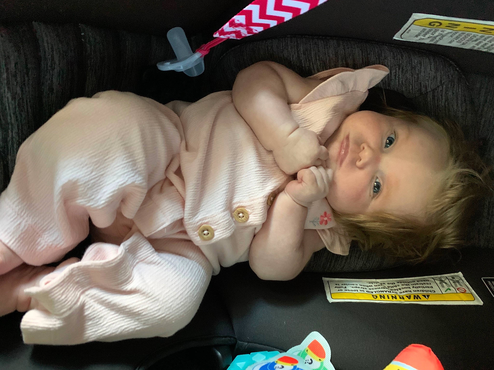 Lena is registered to the contest to win money with this photo: baby, baby_carriage, baby_products, baby_toddler_clothing, car_seat, carmine, cheek, child, comfort, finger, fun, head, lap, mouth, nail, nap, person, sitting, skin, smile