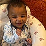 Ayden is registered to the contest to win money with this photo: baby, infant, smiling, onesie, baby_seat, bear_pattern, happy, cute, child, face, hands, indoor, furniture, soft_toy_pattern, portrait, young_child, infant_clothing, baby_boy, fuzzy_hair, cushion