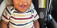 Ayden is registered to the contest to win money with this photo: baby, child, smiling, car_seat, striped_shirt, navy_pants, infant, happy, cute, seat_belt, indoor, person, child_seat, clothing, sitting, face, head, skin, hands, footwear