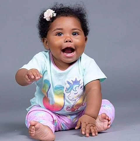 Alexandria joined the competition — help win amazing prizes! arm, baby, baby_toddler_clothing, cheek, child, chin, finger, flash_photography, fun, gesture, happy, nose, person, pink, sitting, skin, sleeve, smile, t_shirt, thumb