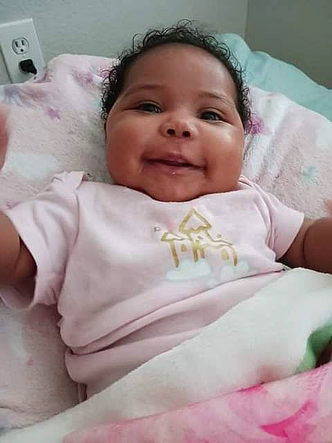 Alexandria is registered to the contest to win money with this photo: baby_toddler_clothing, cheek, chin, comfort, eye, eyebrow, finger, hair, happy, head, iris, lip, neck, nose, person, pink, skin, smile, textile, toddler