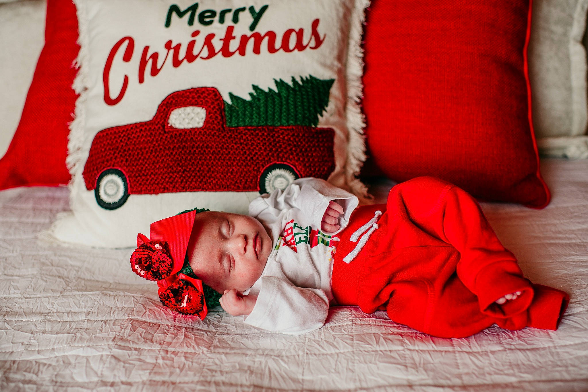 Chloeann joined the competition — help win amazing prizes! baby, child, christmas, christmas_eve, comfort, fictional_character, headwear, linens, person, pillow, red, room, textile