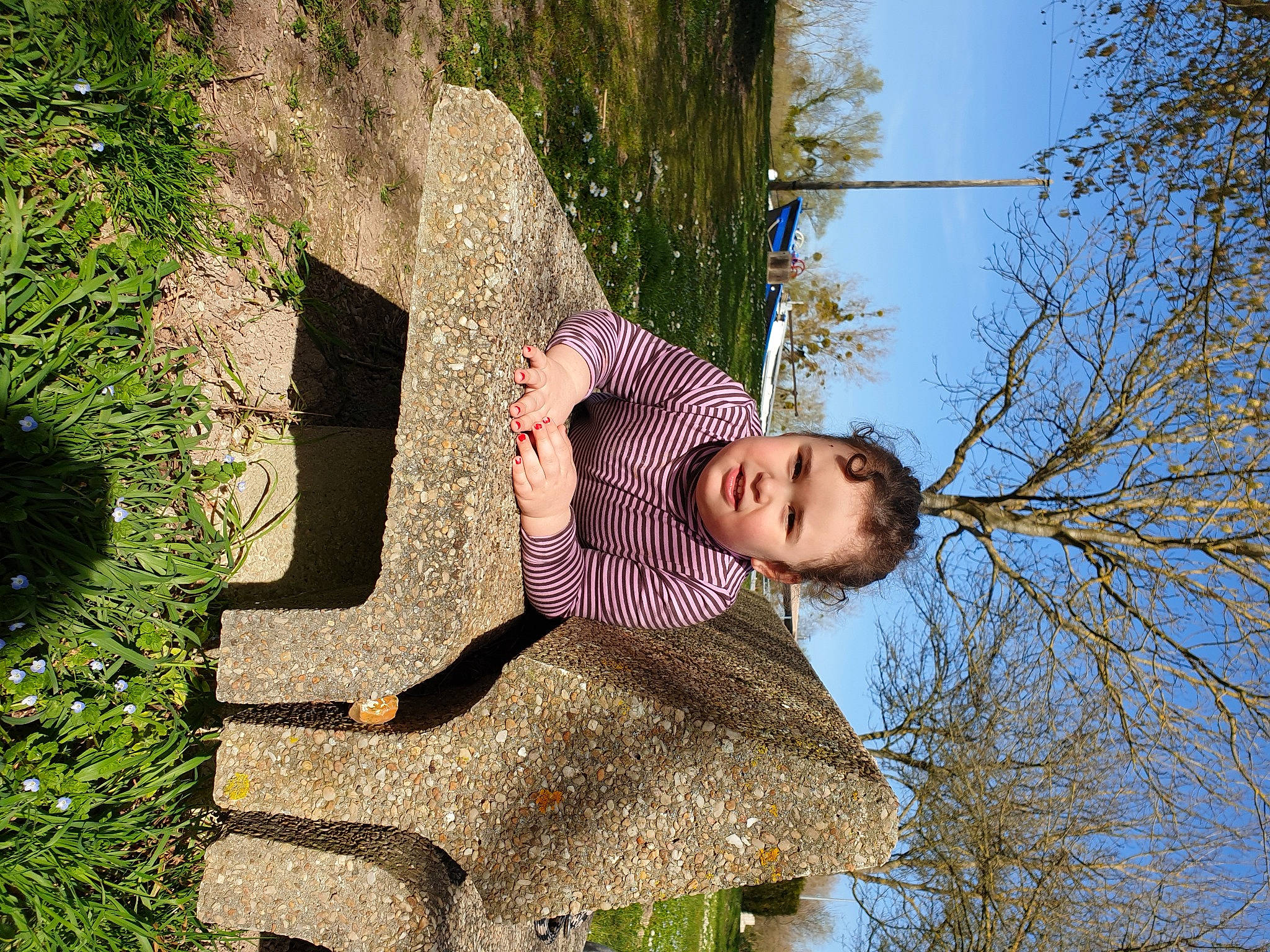 Hannah participe au concours pour gagner de l'argent avec cette photo : child, fun, grass, happy, leisure, people_in_nature, person, plant, recreation, reflection, sitting, sky, spring, toddler, tree, twig, water