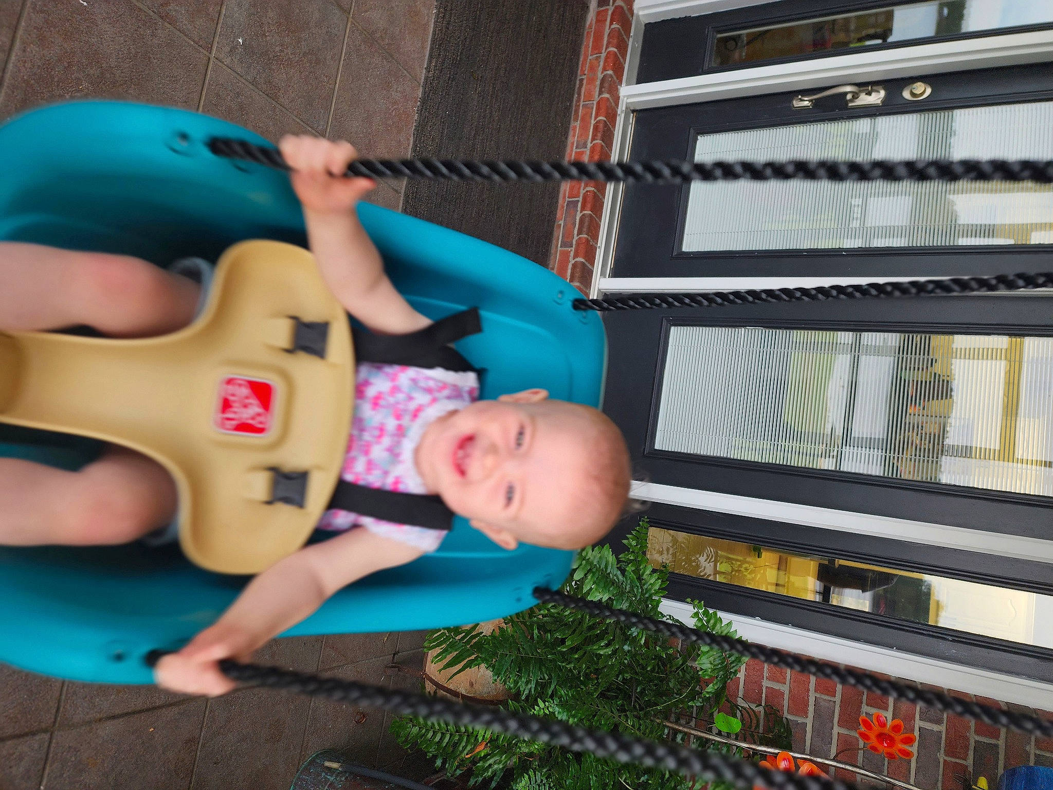 Nora is registered to the contest to win money with this photo: baby, baby_products, child, fictional_character, fun, grass, happy, joy, leisure, mammal, organ, person, personal_protective_equipment, plant, recreation, sitting, snapshot, t_shirt, toddler, toy