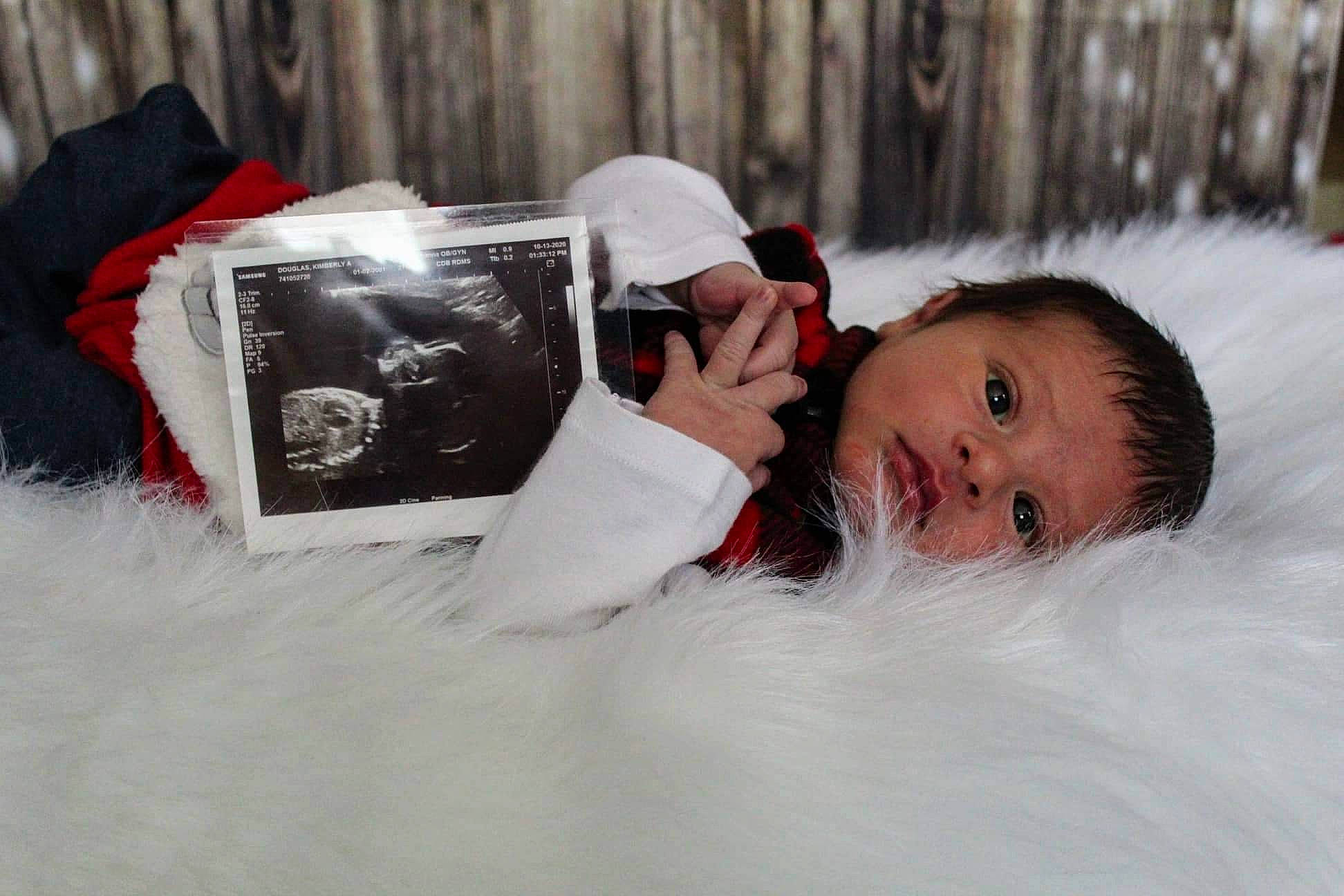 Lance joined the competition — help win amazing prizes! baby, carmine, child, christmas, comfort, event, eyelash, freezing, fun, fur, happy, headgear, linens, person, playing_in_the_snow, portrait_photography, sitting, snow, textile, toddler