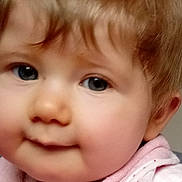 Adele a rejoint le concours — aidez-le/la à gagner de superbes lots ! baby, child, face, closeup, blue_eyes, pink_bib, soft_hair, chubby_cheeks, cute, portrait, infant, young_child, smile, skin, clothing, person, indoor, expression, adorable, head