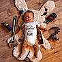 Loan a rejoint le concours — aidez-le/la à gagner de superbes lots ! baby, infant, onesie, floor, wooden_floor, tools, wrench, ratchet, nuts, bolts, keys, beer_bottle, plush_rug, face_smudge, legs_smudge, cute, lying_down, mechanic_theme, child, indoors