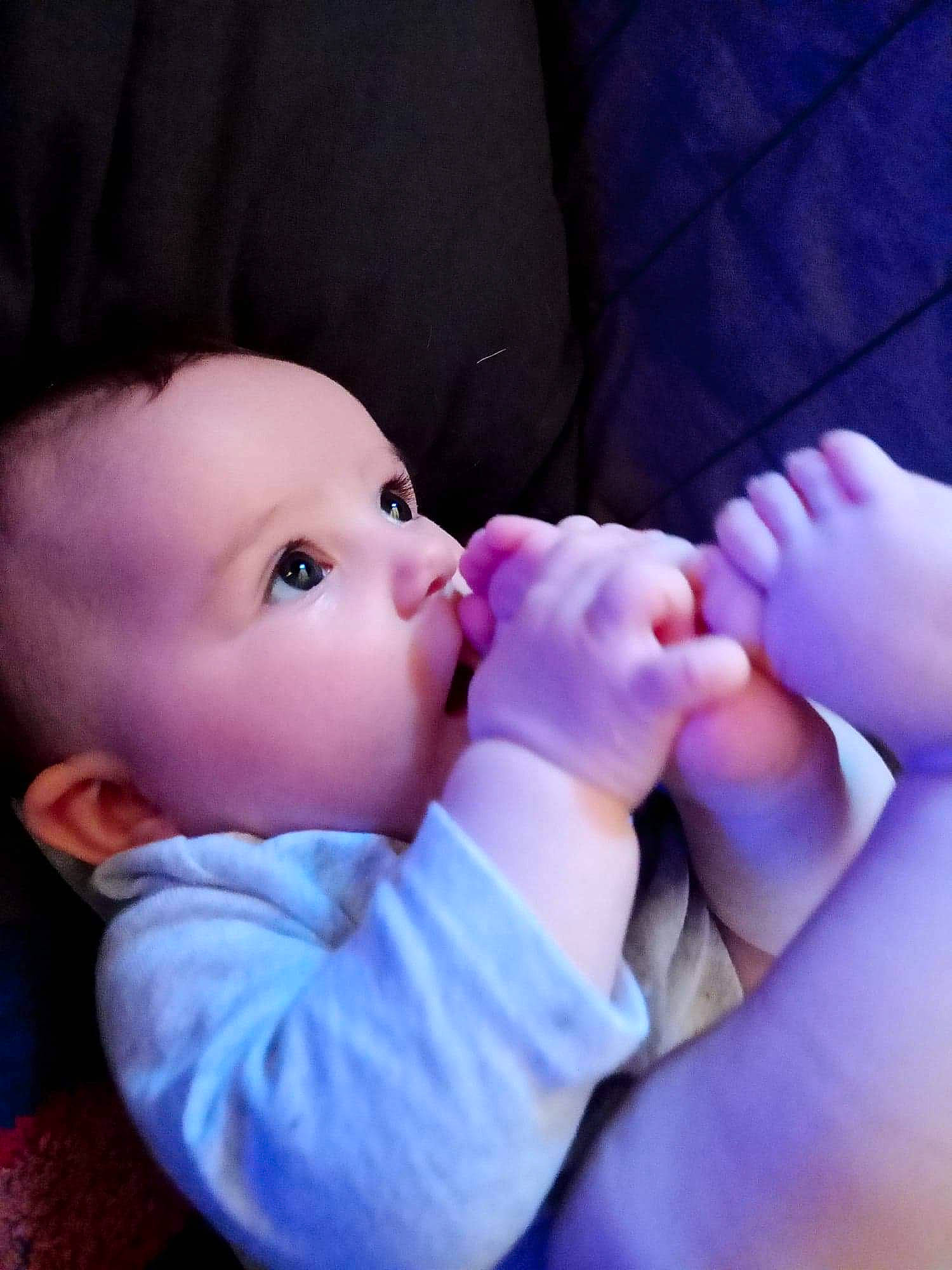 Solara participe au concours pour gagner de l'argent avec cette photo : baby, baby_toddler_clothing, cheek, comfort, drinkware, eyelash, finger, gesture, hand, happy, lip, mouth, nail, nose, person, pink, purple, skin, thumb, toddler