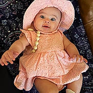 Gemma joined the competition — help win amazing prizes! baby, bodypart, bonnet, cap, clothing, costume, couch, dress, face, finger, furniture, hand, hat, head, newborn, person, photography, portrait, sitting, sunhat