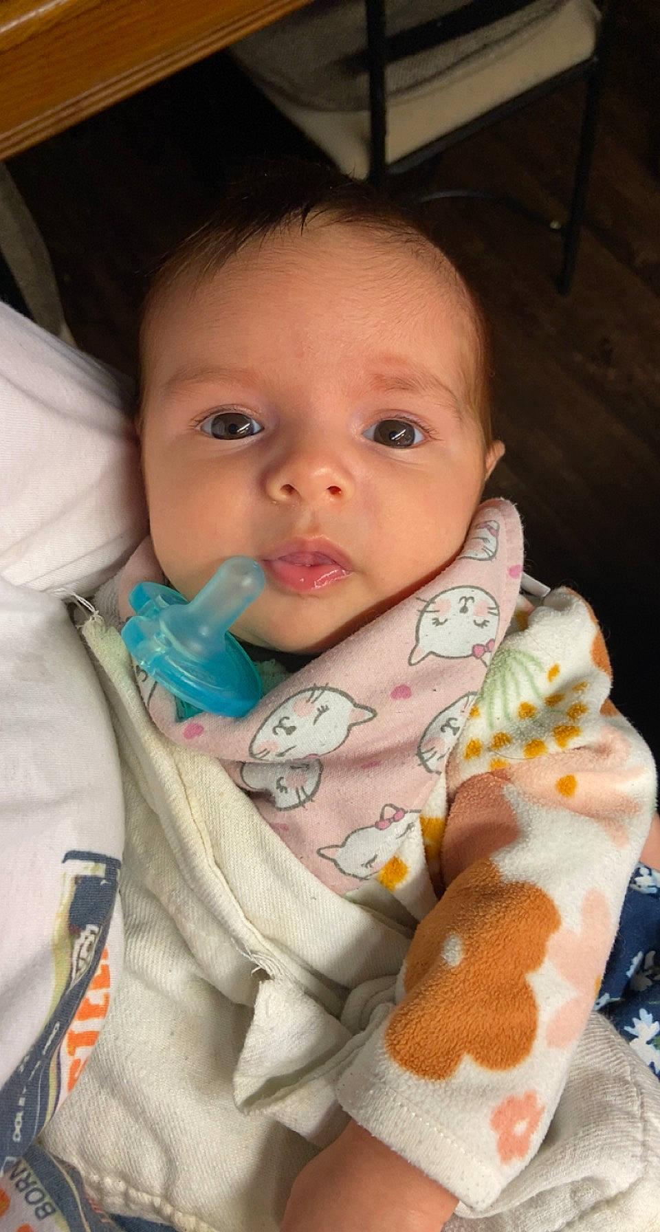 Evie joined the competition — help win amazing prizes! baby, baby_products, baby_toddler_clothing, bib, cheek, child, chin, comfort, facial_expression, finger, hand, iris, linens, lip, mouth, nose, outerwear, person, skin, sleeve