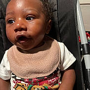 Elijah joined the competition — help win amazing prizes! baby, infant, child, toddler, bib, tshirt, cartoon, bear, stroller, seat, curious, expression, skin, hand, clothing, portrait, indoors, young, person, cute
