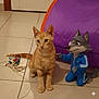 cat, orange_tabby, animal, pet, floor, tile, indoor, toy, cord, purple, tent, cartoon_wolf, blue_tracksuit, kneeling, playful, curious, ears, whiskers, tail, eyes