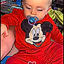 Dgino participe au concours pour gagner de l'argent avec cette photo : baby, blanket, casual, child, colorful, cute, face, furniture, head, heart_doodle, indoor, mickey_mouse, pacifier, person, red_clothing, sitting, table, toddler, toy, water_bottle