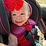 baby, car_seat, red_bow, smiling, child, infant, purple, seatbelt, car_interior, sunlight, headband, clothing, cute, happy, face, safety_harness, window, toy, child_seat, portrait