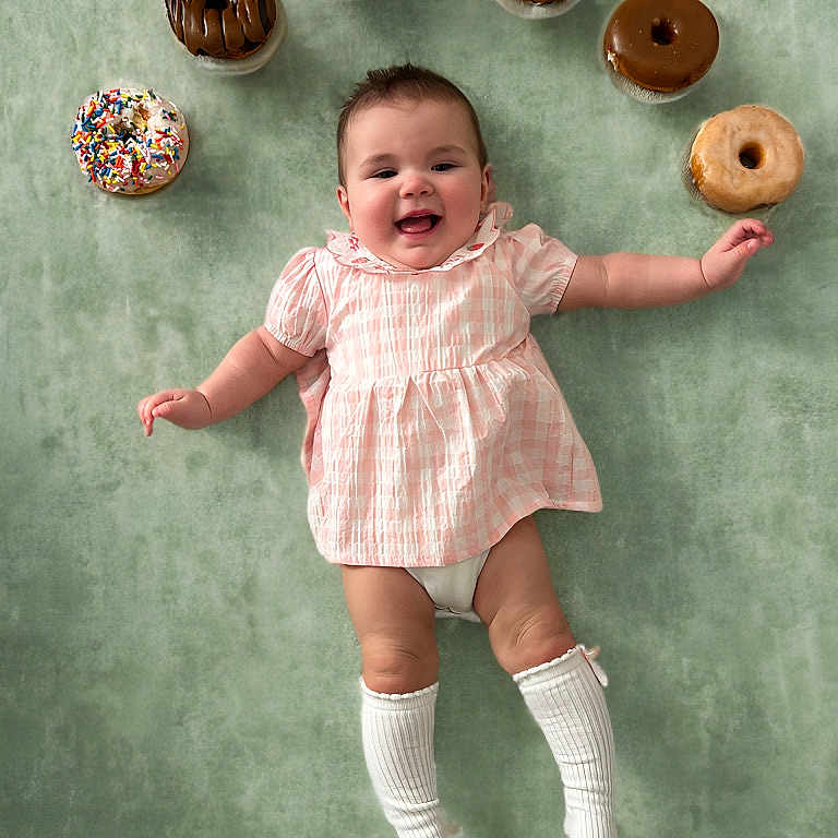 Charlotte joined the competition — help win amazing prizes! baby, bodypart, bread, clothing, cream, dessert, donut, face, finger, food, hand, happy, head, hosiery, icing, person, photography, portrait, sock, sweets