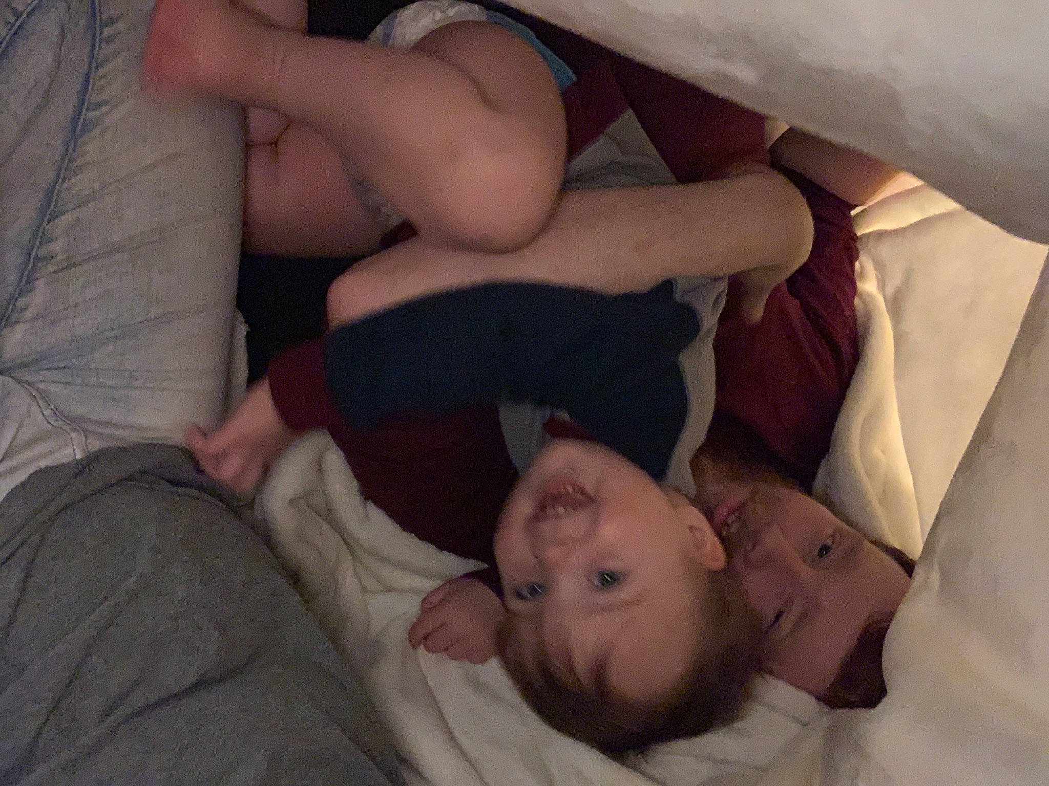 Leighton is registered to the contest to win money with this photo: abdomen, baby, barechested, chest, child, comfort, elbow, eye, foot, gesture, human_leg, joy, knee, linens, mouth, person, room, skin, thigh, thumb