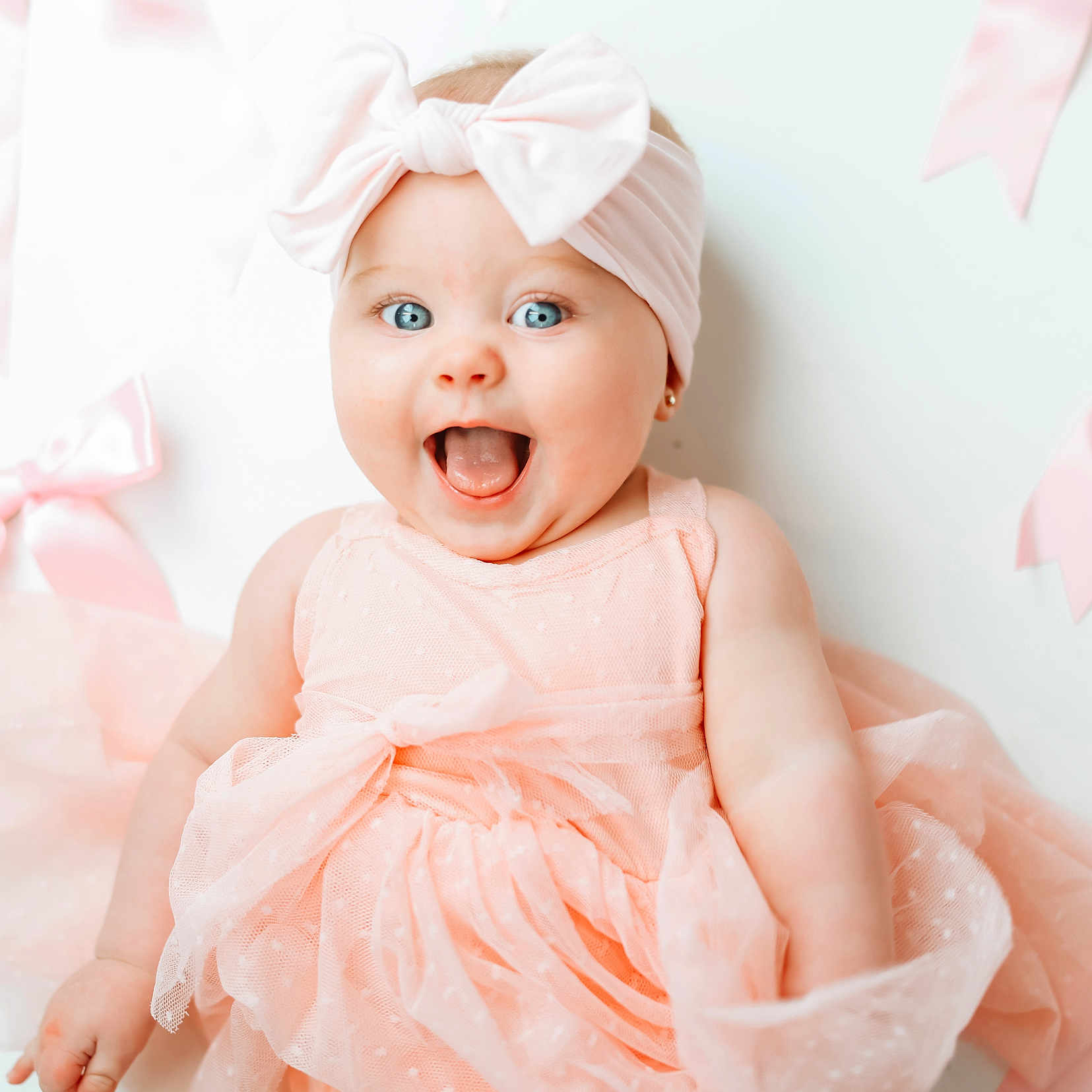 Tatum joined the competition — help win amazing prizes! adorable, baby, blue_eyes, bow, cheerful, child, close_up, cute, fashion, happy, headband, infant, person, pink_dress, portrait, ribbons, smiling, soft_light, tulle, white_background