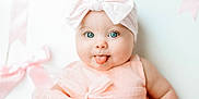 Tatum joined the competition — help win amazing prizes! adorable, baby, baby_fashion, blue_eyes, bow, cheeky, child, closeup, cute, happy, headband, indoor, infant, person, pink_dress, portrait, skin, smiling, soft_lighting, tongue