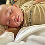 Andrea participe au concours pour gagner de l'argent avec cette photo : baby, sleeping, face, child, infant, clothing, text, fabric, comfort, closeup, skin, head, peaceful, rest, portrait, young_child, cute, indoors, soft_light, nap