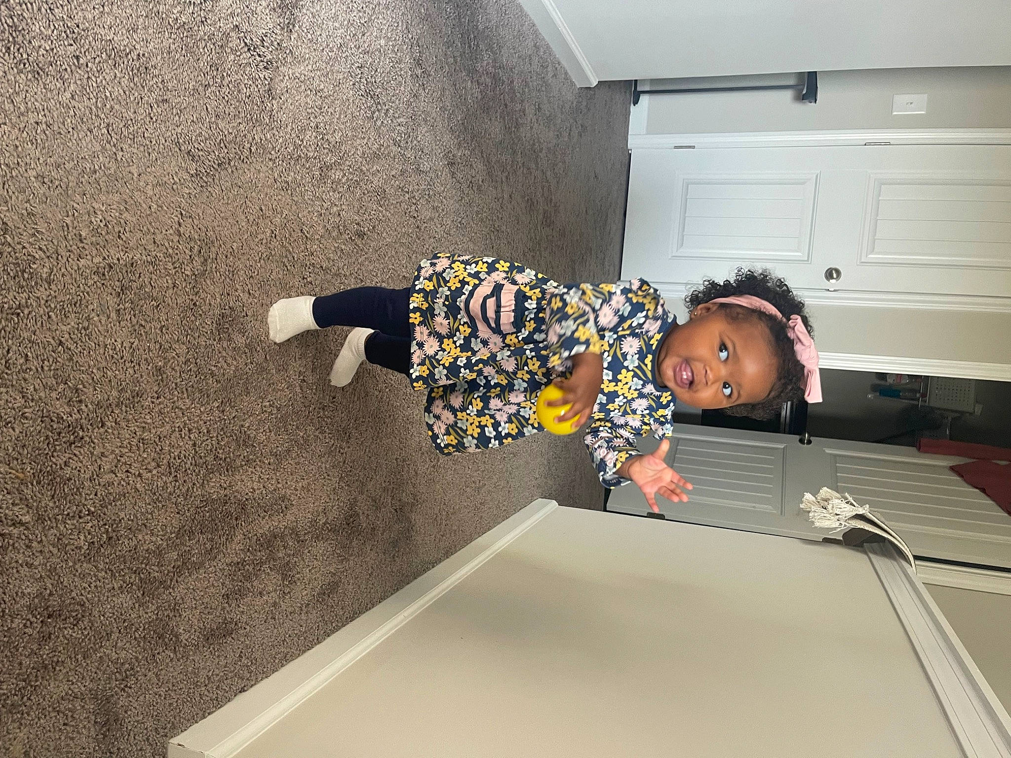 Haven is registered to the contest to win money with this photo: baby, cabinetry, chest_of_drawers, child, comfort, cupboard, drawer, floor, flooring, fun, hardwood, home_appliance, house, kitchen, laundry_room, person, play, room, t_shirt, toddler