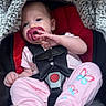 Madalynn is registered to the contest to win money with this photo: baby, infant, child, car_seat, safety_harness, pacifier, pink_clothing, pajamas, butterfly_pattern, blanket, gray_blanket, seated, portrait, indoor, vehicle, cozy, calm, face, hand_gesture, photography