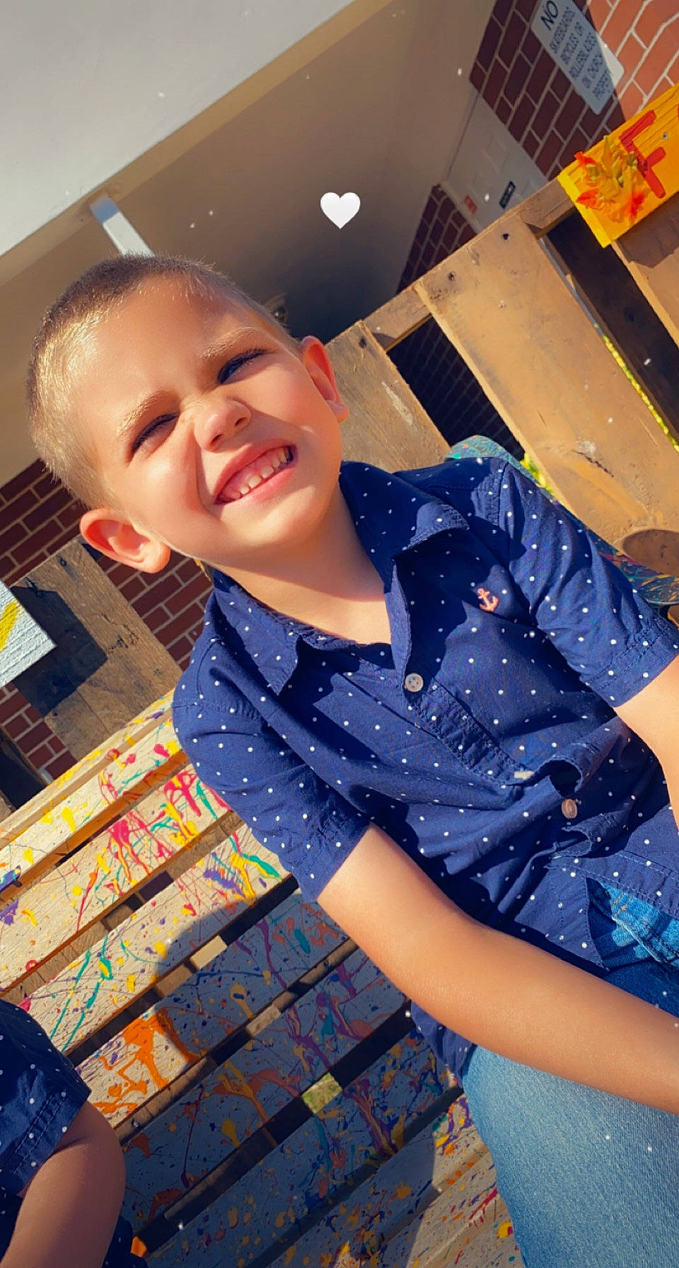 Joseph is registered to the contest to win money with this photo: black_hair, child, denim, electric_blue, fashion_design, fun, happy, human_leg, joy, laugh, leisure, magenta, pattern, person, plaid, portrait_photography, room, sitting, sleeve, smile