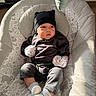 David joined the competition — help win amazing prizes! baby, infant, child, portrait, sitting, bouncer, baby_chair, black_hat, bear_hat, mittens, socks, dark_clothing, smiling, indoors, sunlight, cushion, blanket, nursery, cozy, patterned_fabric