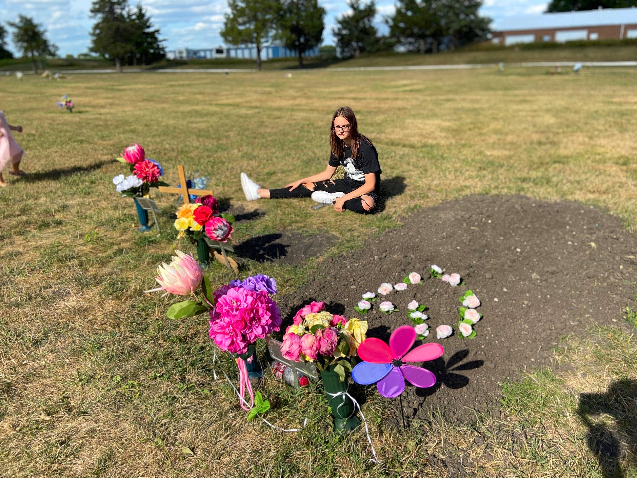Nevaeh is registered to the contest to win money with this photo: adaptation, botany, cemetery, community, ecoregion, flower, grass, grass_family, grave, impatiens, leisure, nonbuilding_structure, person, pink, plant, plant_community, recreation, soil, spring, tree