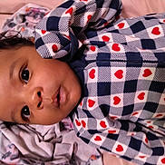 Emerlee joined the competition — help win amazing prizes! baby, babywear, blanket, child, closeup, clothing, cute, expression, eyes, face, hearts, indoors, infant, lying_down, pattern, portrait, sleepwear, soft, warm, young