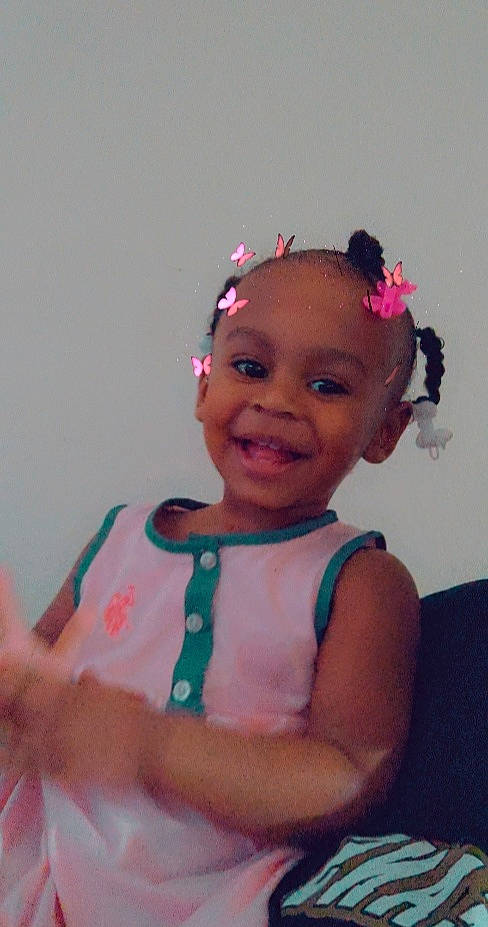 Kylei is registered to the contest to win money with this photo: baby_toddler_clothing, cheek, child, eye, eyebrow, face, fun, hair_accessory, happy, head, headband, headgear, headpiece, jewellery, joy, magenta, neck, person, pink, sleeve