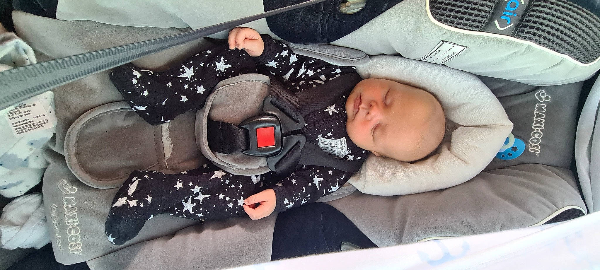 Brock is registered to the contest to win money with this photo: auto_part, baby, baby_carriage, baby_products, baby_sleeping, baby_toddler_clothing, child, comfort, nap, pattern, person, personal_protective_equipment, sitting, sleep, sleeve, thigh, toddler