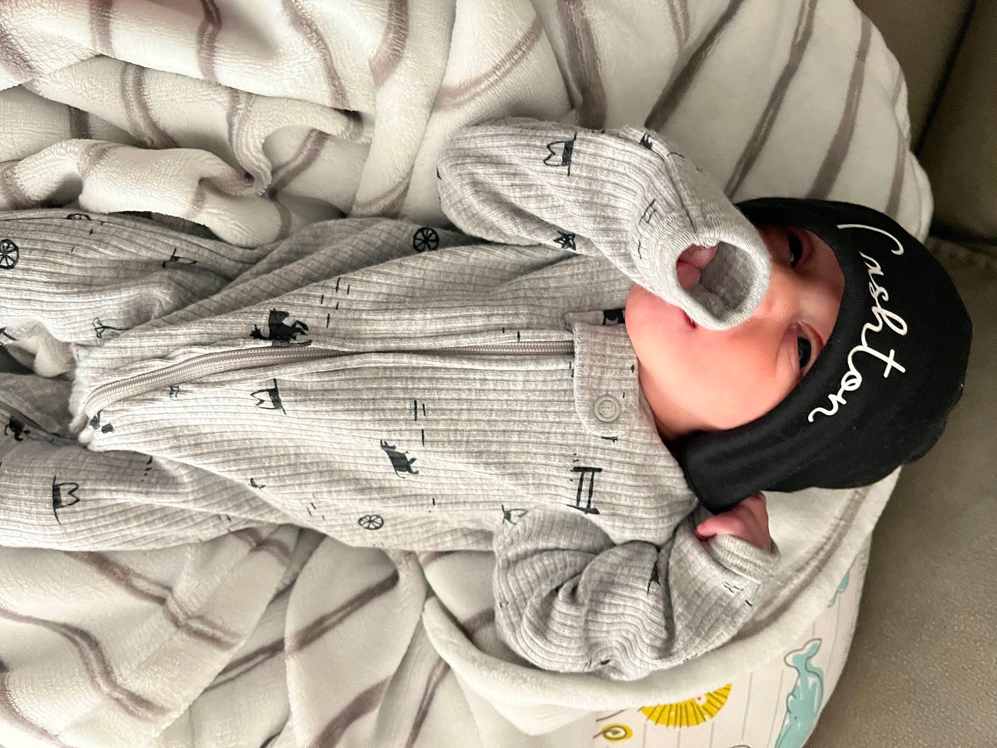 Cashton is registered to the contest to win money with this photo: carmine, comfort, drinkware, elbow, eyewear, fashion_accessory, font, gesture, grey, headwear, human_leg, linens, monochrome, monochrome_photography, pattern, person, shoe, sitting, sneakers, sunglasses