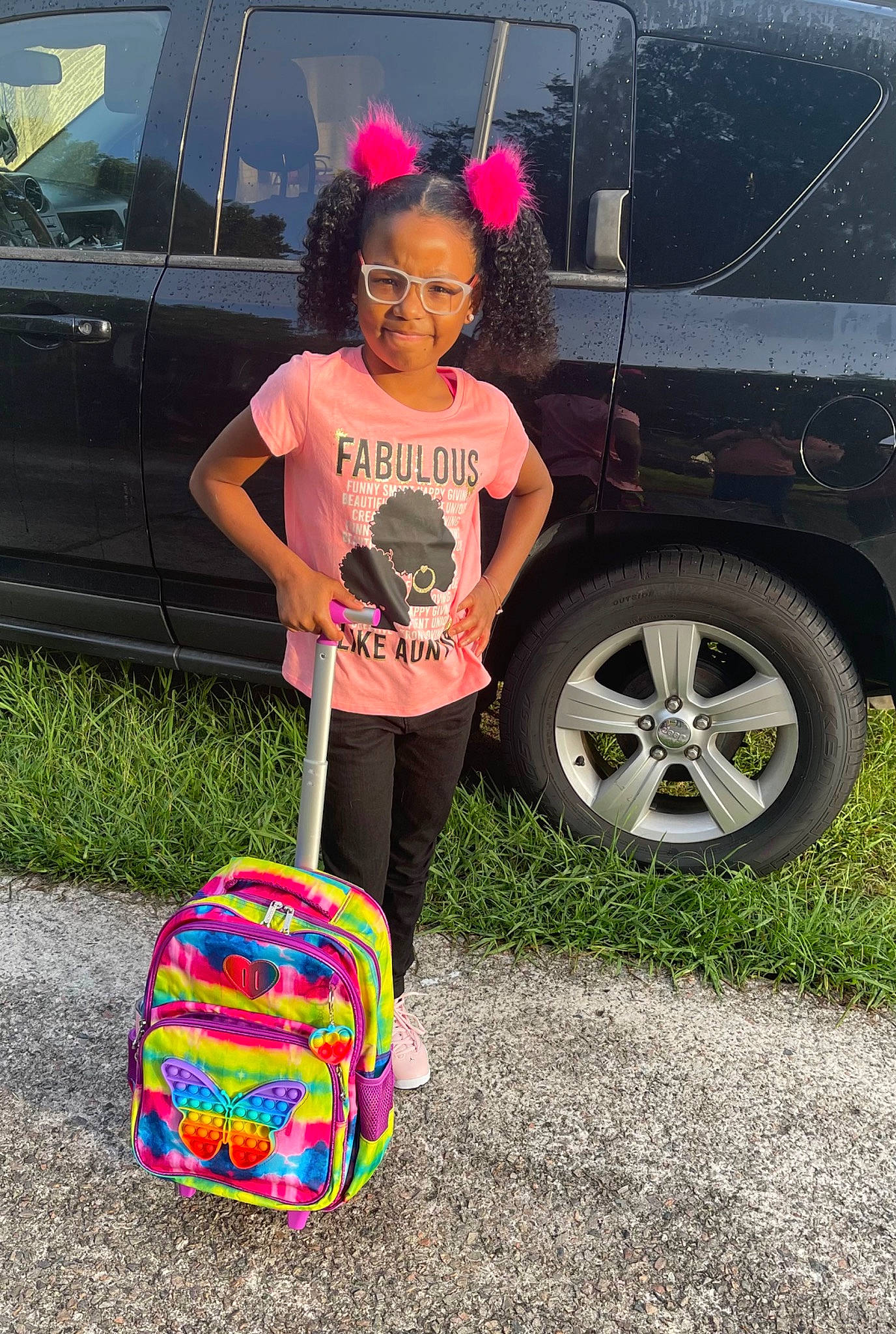 Aryanna joined the competition — help win amazing prizes! asphalt, automotive_design, automotive_exterior, automotive_tire, automotive_wheel_system, bag, car, electric_blue, family_car, grass, land_vehicle, luggage_and_bags, motor_vehicle, person, pink, rim, tints_and_shades, tire, vehicle, vehicle_door