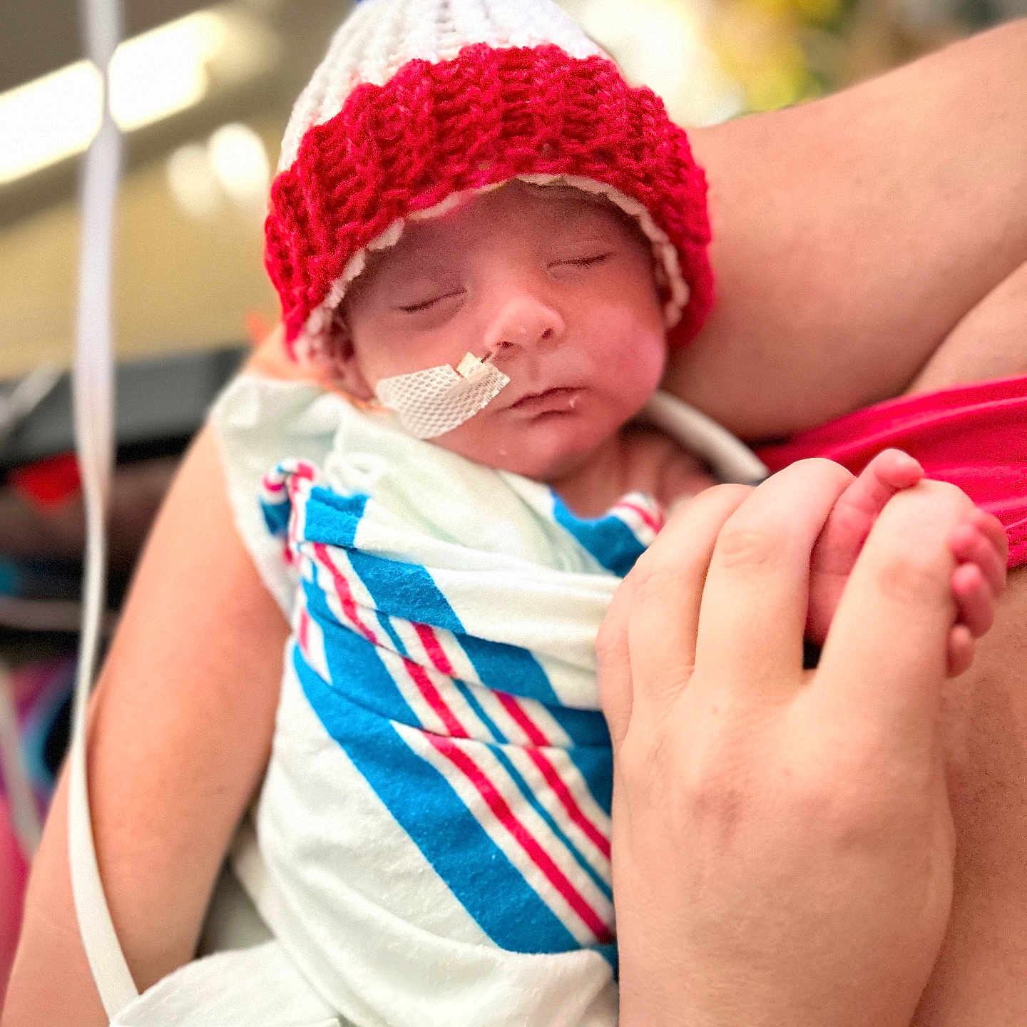 Jessy joined the competition — help win amazing prizes! arm, baby, blanket, blue, care, child, closeup, hand, hospital, infant, knitted_hat, medical_tape, newborn, person, red, rest, skin, sleeping, swaddled, tube