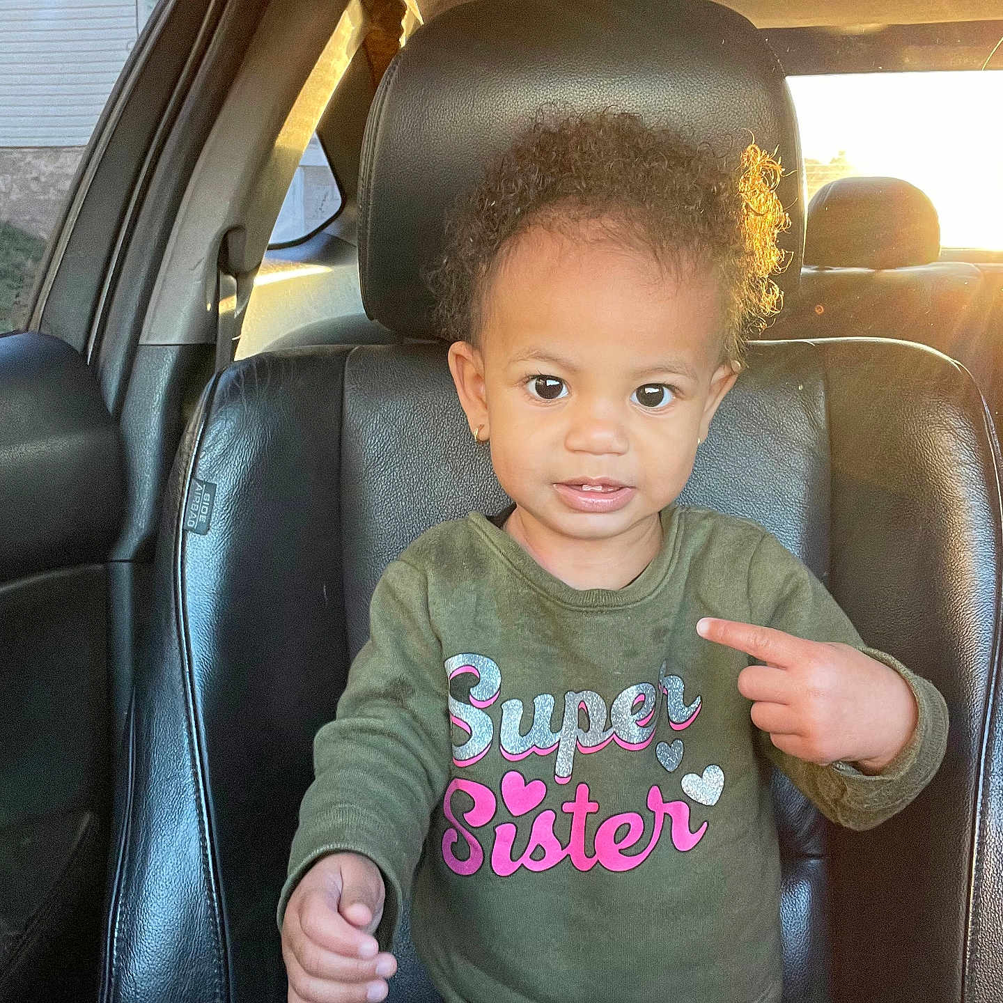 Aurora joined the competition — help win amazing prizes! baby, bodypart, car, clothing, curlyhair, cushion, face, finger, hair, hand, head, headrest, homedecor, person, photography, portrait, sleeve, t_shirt, transportation, vehicle