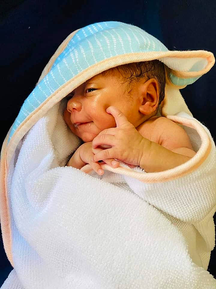 Isabella is registered to the contest to win money with this photo: baby, baby_products, baby_sleeping, bedtime, cap, cheek, comfort, eye, fashion_accessory, fur, gesture, happy, hat, headwear, knit_cap, linens, nap, nose, person, textile