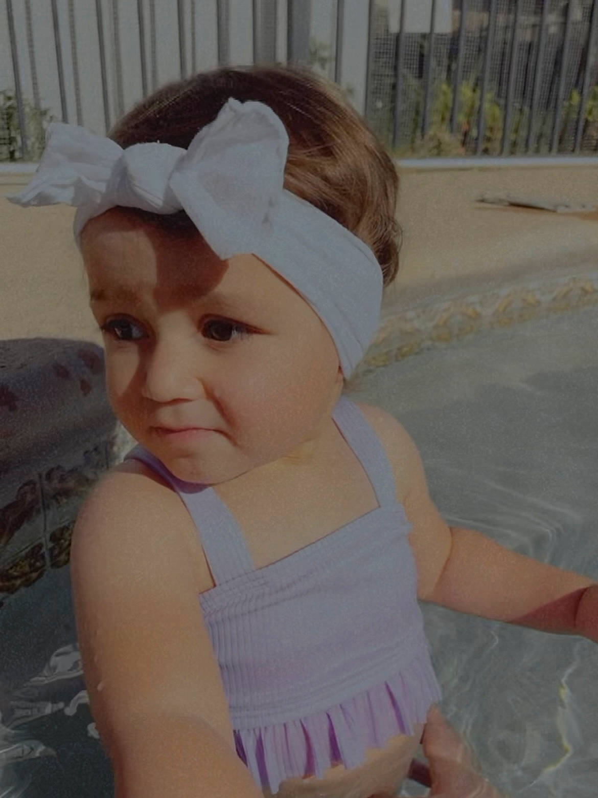 Serenity Rose is registered to the contest to win money with this photo: baby, baby_toddler_clothing, bonnet, bridal_accessory, cap, child, ear, fashion_accessory, fun, grass, hair_accessory, happy, headband, headpiece, headwear, person, pink, sitting, skin, sleeve