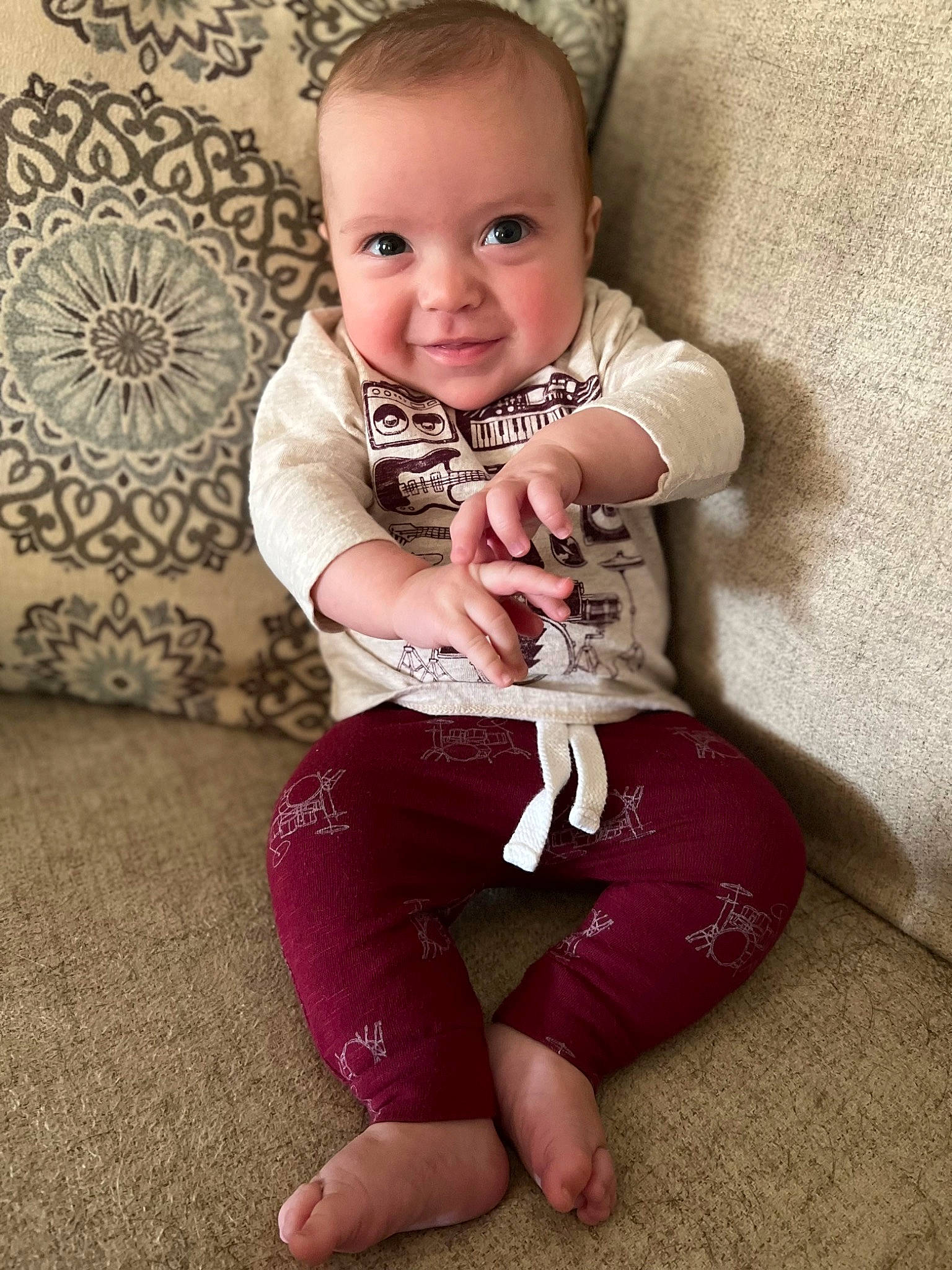 Eric is registered to the contest to win money with this photo: baby, baby_toddler_clothing, cheek, child, comfort, face, facial_expression, flash_photography, flooring, happy, knee, leg, person, pink, skin, sleeve, smile, t_shirt, thigh, toddler
