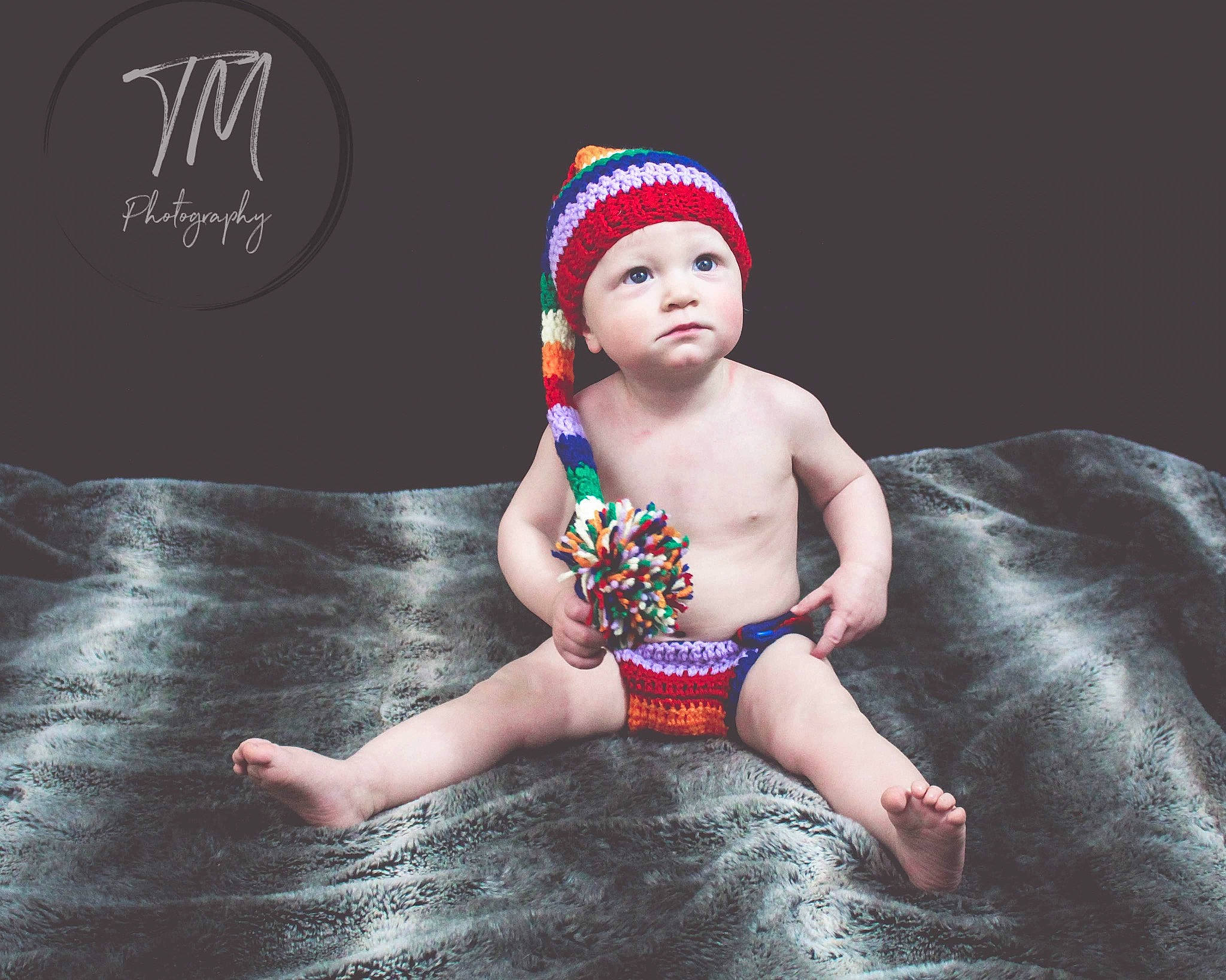 Mackinnon is registered to the contest to win money with this photo: baby, beanie, cap, child, child_model, costume_accessory, fashion_accessory, fun, hair_accessory, headgear, headpiece, headwear, knit_cap, leisure, person, personal_protective_equipment, photography, swim_cap, swimwear, toddler