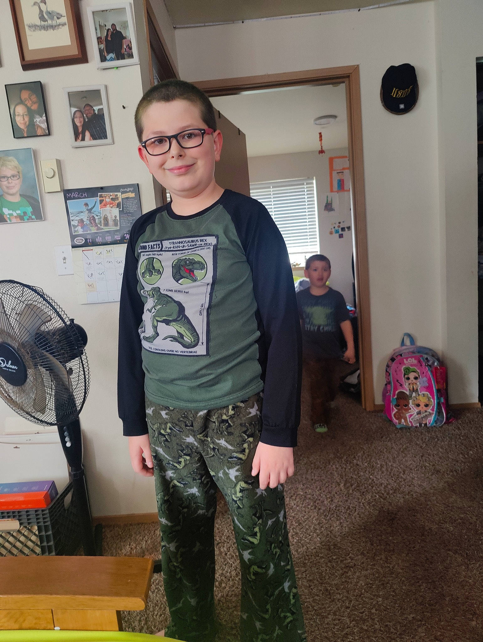 Jacob Denney is registered to the contest to win money with this photo: belt, blurred, clock, cool, eyewear, fashion_design, flooring, fun, glasses, joy, knee, machine, mechanical_fan, person, personal_protective_equipment, room, shoulder, sleeve, sunglasses, t_shirt