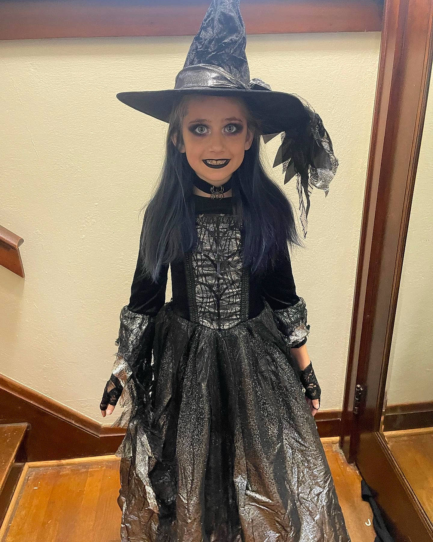 Mckenzie is registered to the contest to win money with this photo: black_hair, costume_hat, doll, dress, fashion_accessory, fashion_design, fedora, fictional_character, fur, hat, headgear, human_body, jewellery, joy, necklace, person, sleeve, smile, sun_hat, toy