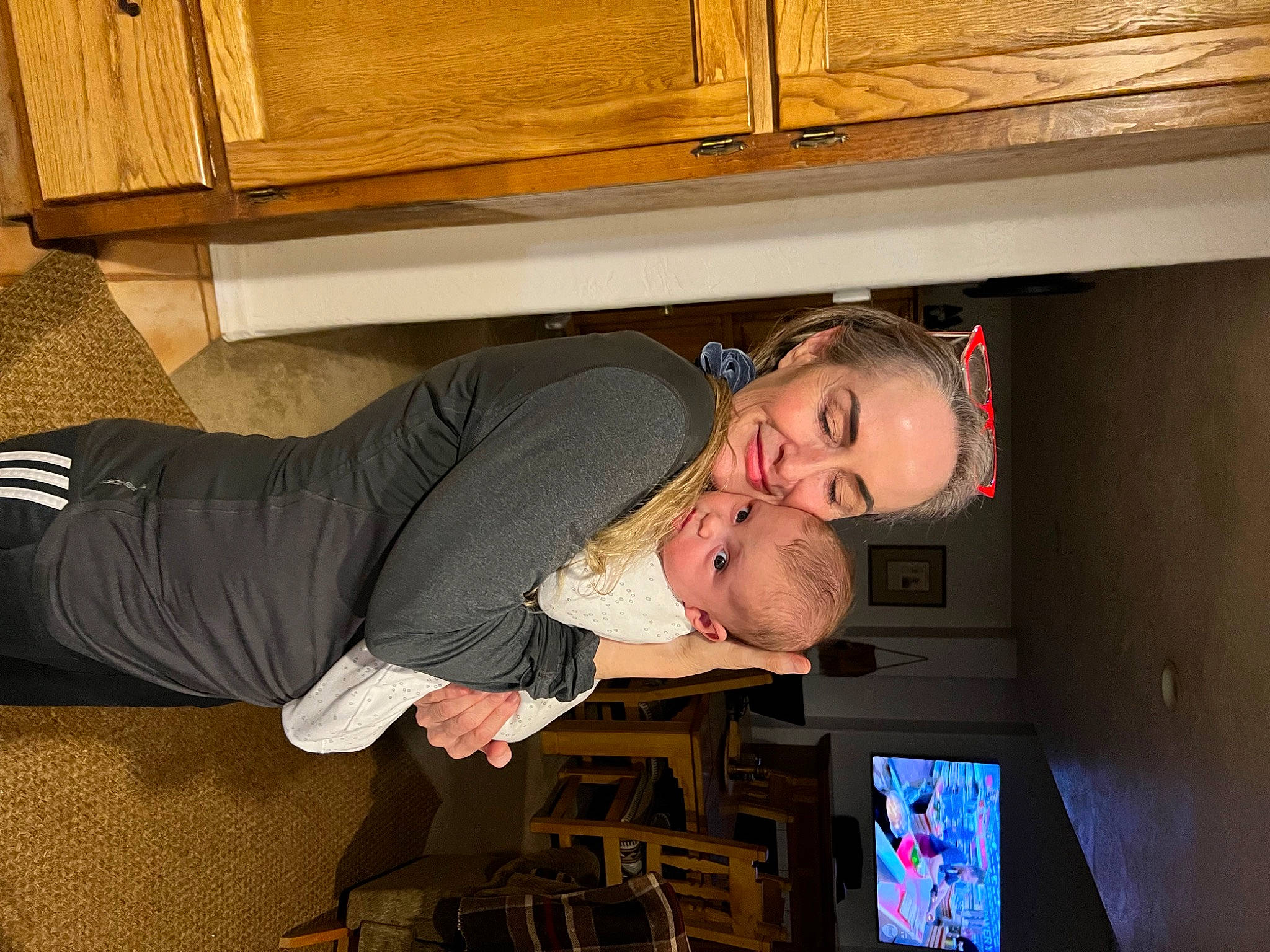 Cassie is registered to the contest to win money with this photo: comfort, flooring, fun, hardwood, hat, human_leg, joy, knee, person, room, sleeve, smile, thigh, varnish, wood, wood_stain, wrist