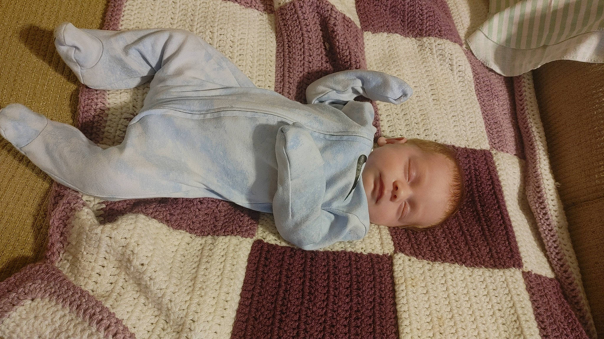 Isabeau is registered to the contest to win money with this photo: baby, baby_sleeping, baby_toddler_clothing, bedding, child, comfort, couch, face, floor, flooring, head, linens, pattern, person, room, sitting, skin, sleeve, textile, toddler