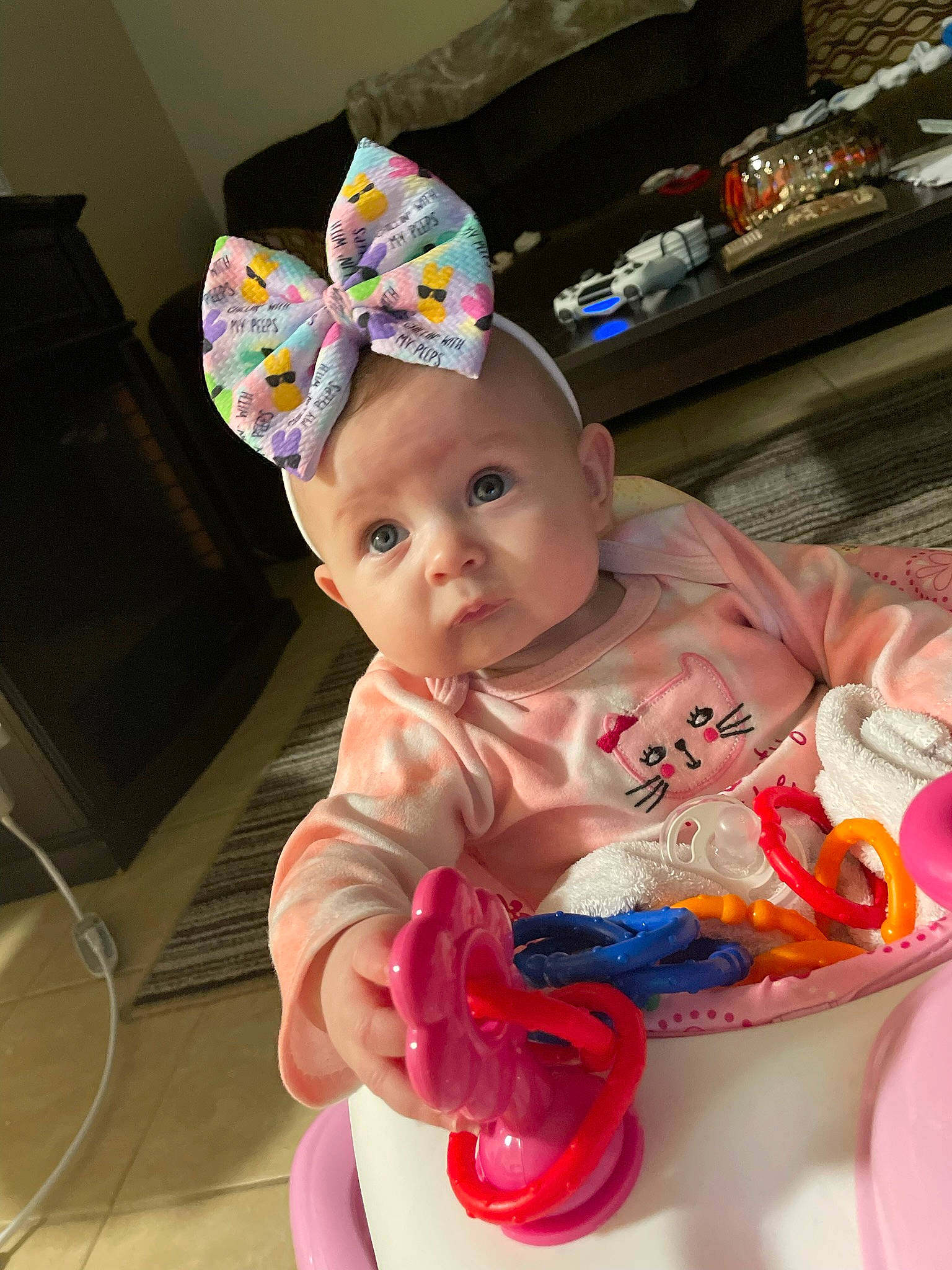 Kora is registered to the contest to win money with this photo: baby, baby_products, baby_toddler_clothing, cap, cheek, child, costume, costume_hat, event, fashion_accessory, fictional_character, fun, happy, headpiece, party_hat, party_supply, person, pink, play, sitting