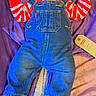Yaman joined the competition — help win amazing prizes! baby, infant, denim_overalls, striped_shirt, red_and_white, purple_blanket, pink_blanket, lying_down, cute, fist, face, hair, footwear, tag, clothing, child, indoors, portrait, looking_away, soft_texture