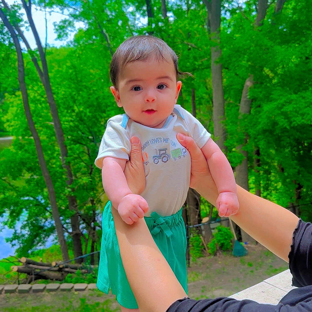 Taim joined the competition — help win amazing prizes! baby, child, person, outdoor, greenery, trees, nature, balcony, summer, daylight, holding, hands, shirt, shorts, curious, face, skin, arm, foot, background