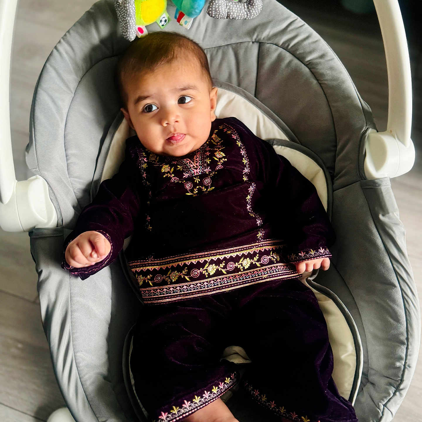 Alaira is registered to the contest to win money with this photo: baby, bed, bodypart, clothing, cradle, crib, cushion, dress, face, finger, furniture, hand, head, homedecor, infantbed, person, photography, portrait, transportation, vehicle