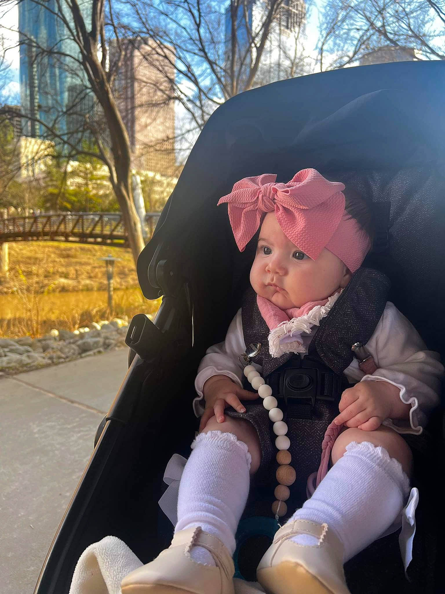 Rhyatt Rae is registered to the contest to win money with this photo: baby_carriage, baby_products, cap, cool, eyewear, fashion_accessory, fun, fur, glove, grass, happy, headgear, headwear, leisure, magenta, person, personal_protective_equipment, recreation, sitting, toddler
